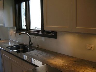 green back painted glass for kitchen backsplash