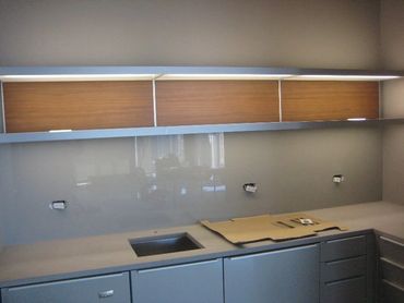 green back painted glass for kitchen backsplash