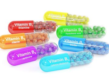 Colorful capsules representing various Vitamin B types with labeled names and components.