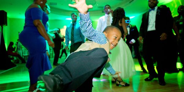 Little boy enjoying DJ 360's music at a wedding reception at Embasy Suites Brier Creek in Raleigh.