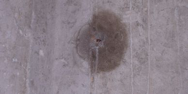Leak around a metal foundation tie.