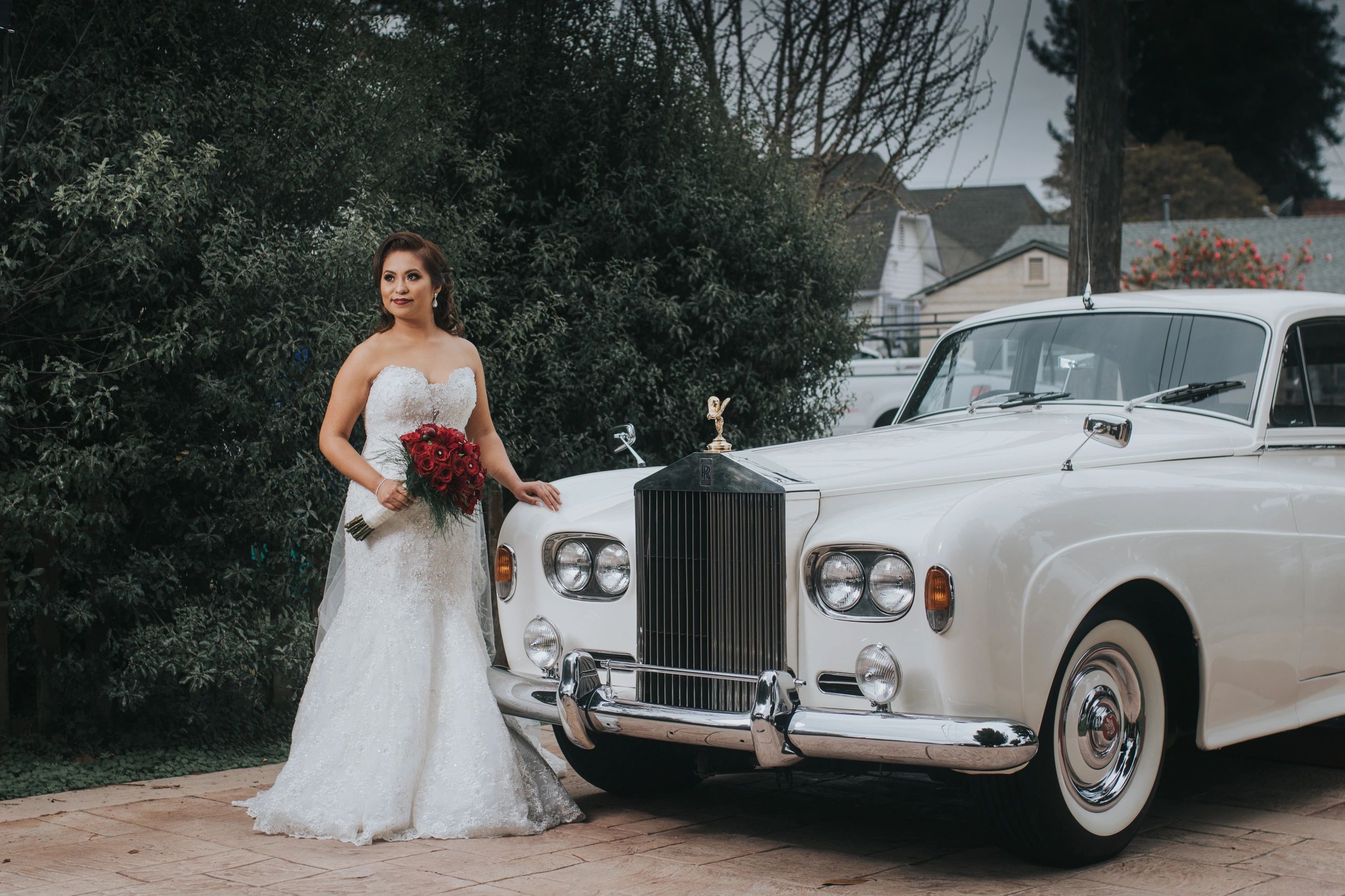 Beautiful Bride standing next to the gorgeous 1963 Rolls Royce Sliver Cloud III