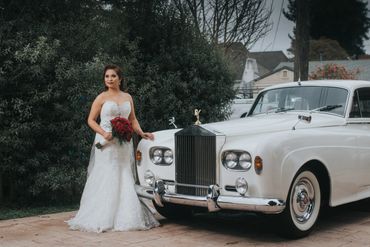 Vintage Rolls Royce Limo & Car Services for Weddings - Bride in Wedding Dress Standing in Front