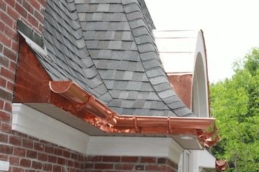 Copper gutters and downspouts