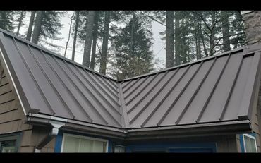 New construction metal roof and steel gutters