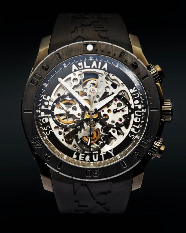 Close-up of a luxury skeleton watch with intricate gears.