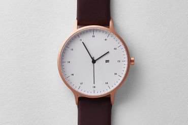 Modern wristwatch with brown leather strap and white dial.