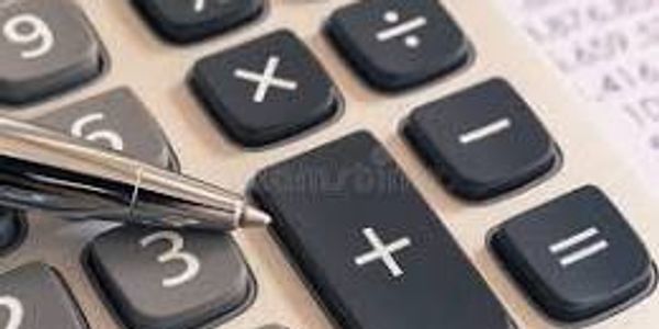 Close-up of calculator buttons with a pen pointing at the plus key.