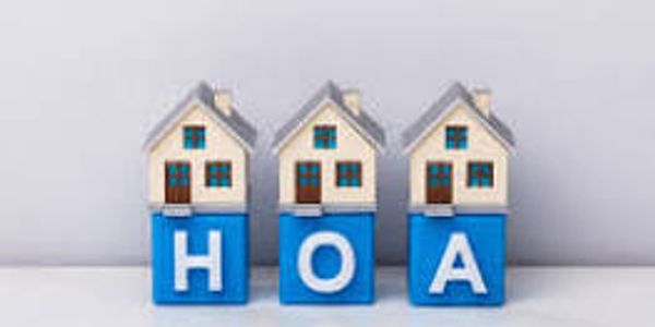 Three houses on blocks spelling HOA.