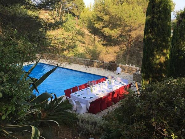 Dinner poolside at a luxury villa rental in the South of France