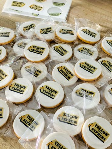 Packaged cookies with Yellow Express logo on white icing.