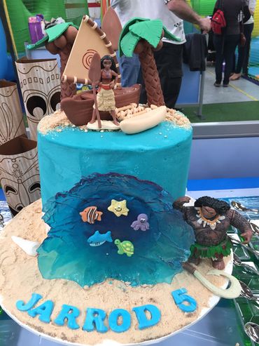 Moana-themed birthday cake with ocean, characters, and palm trees for Jarrod's 5th birthday.
