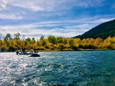 fly fishing guide jake schilling on the upper madison river, montana.