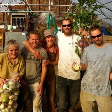 Archived photo of (L-R) Christy, Brad, Becca, Caleb and Adam) during harvest time in the fall.