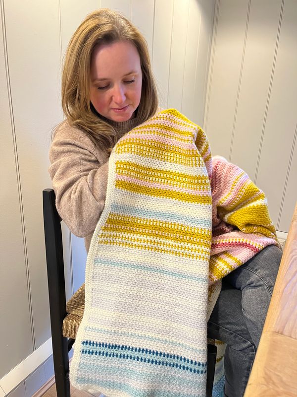 Suzanne Booth, mentoring yarn and textile craft enthusiasts, to make money from their craft.