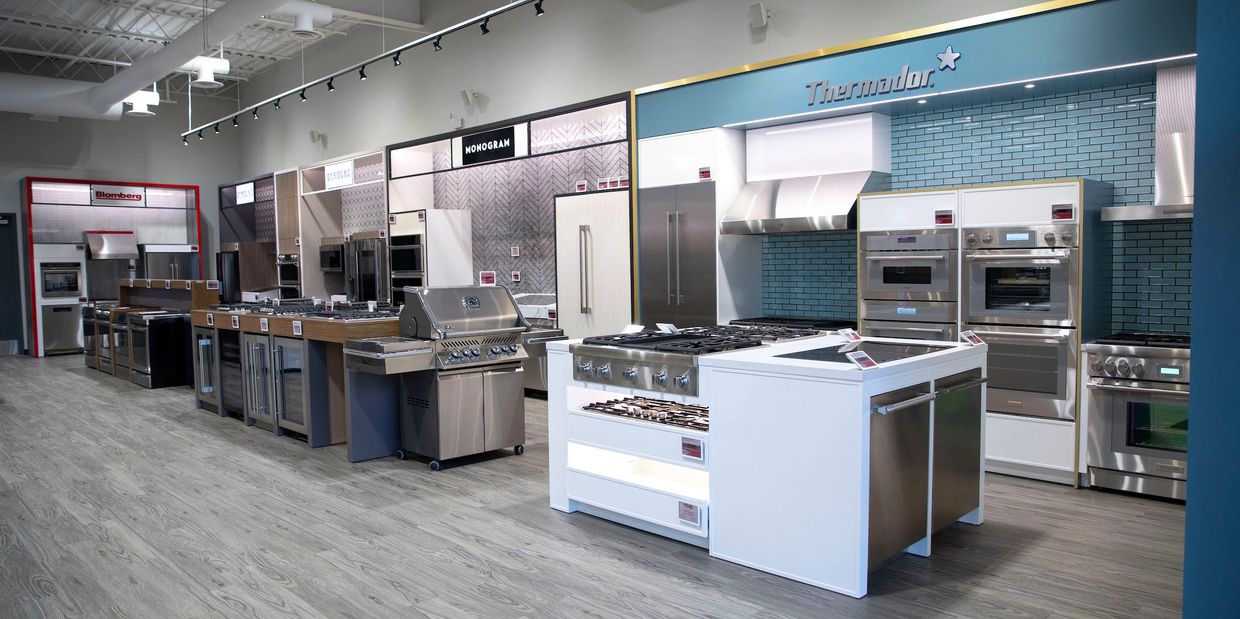 Exhibition display featuring kitchen appliances integrated into custom cabinetry by TKB Group.