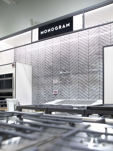 Oven displayed at an exhibition, integrated into custom cabinetry designed and installed by TKB