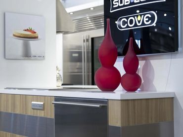 Exhibition display featuring dishwasher integrated into custom cabinetry by TKB Group.