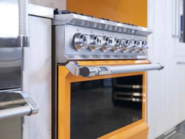 Oven displayed at an exhibition, integrated into custom cabinetry designed and installed by TKB