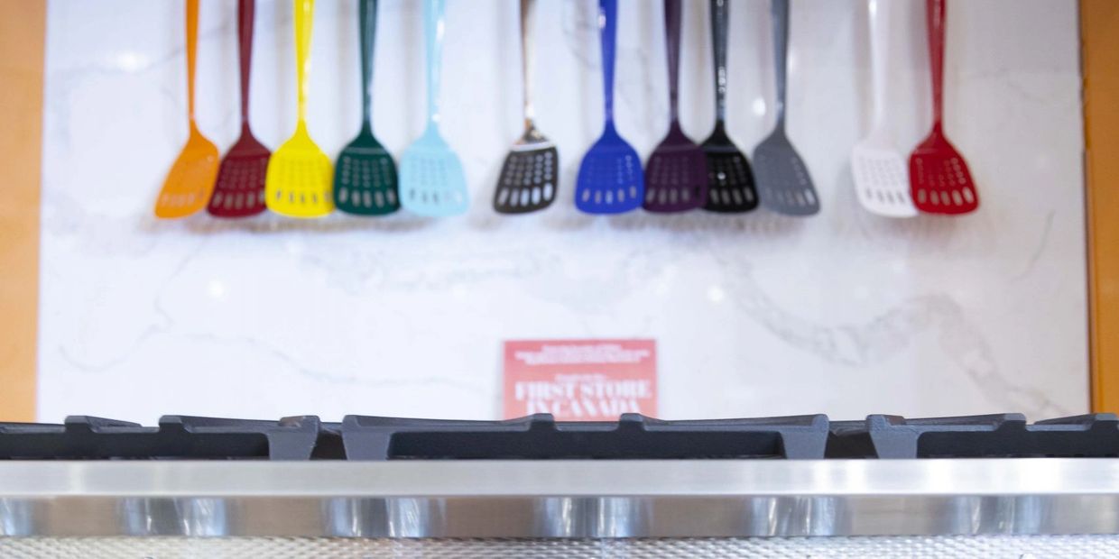 Oven displayed at an exhibition, integrated into custom cabinetry designed and installed by TKB