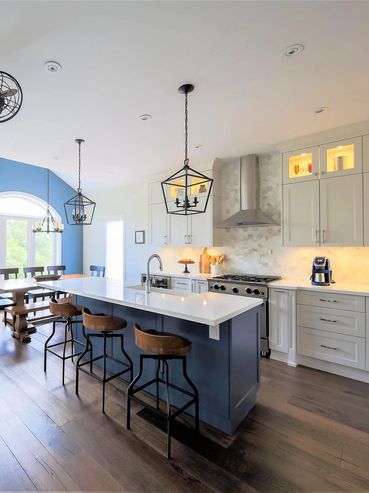 Blue kitchen featuring brown accents and creative lamps, combining vibrant colors and unique design.