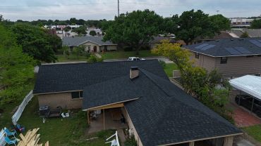 Residential neighborhood, Beautiful Matte black shingle roof with added patio