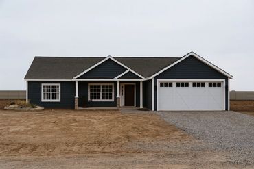 Modular home exterior with modern siding and black trim in Indiana