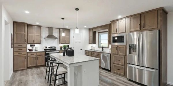 Doublewide Manufactured Home on a spacious rural property with driveway and grading work.