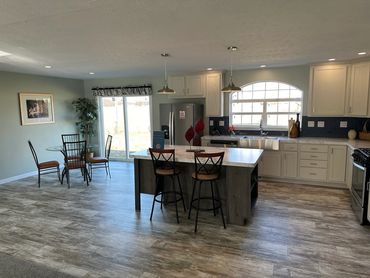 Energy-efficient manufactured home with beautiful landscaping by Fahl Homes.