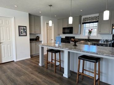 Spacious mobile home with stylish finishes and site work included.