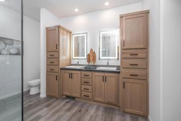 Fahl Homes crew levels a newly placed doublewide home.