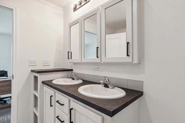 Fahl Homes prepares mobile homes for final leveling and anchor installation.