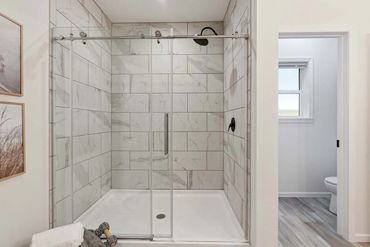 Doublewide installation process—delivery, setting, and leveling shown.