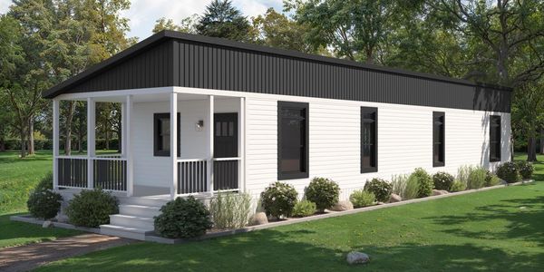 Modern Singlewide Modular Home exterior placed with full site work and concrete foundation pad.
