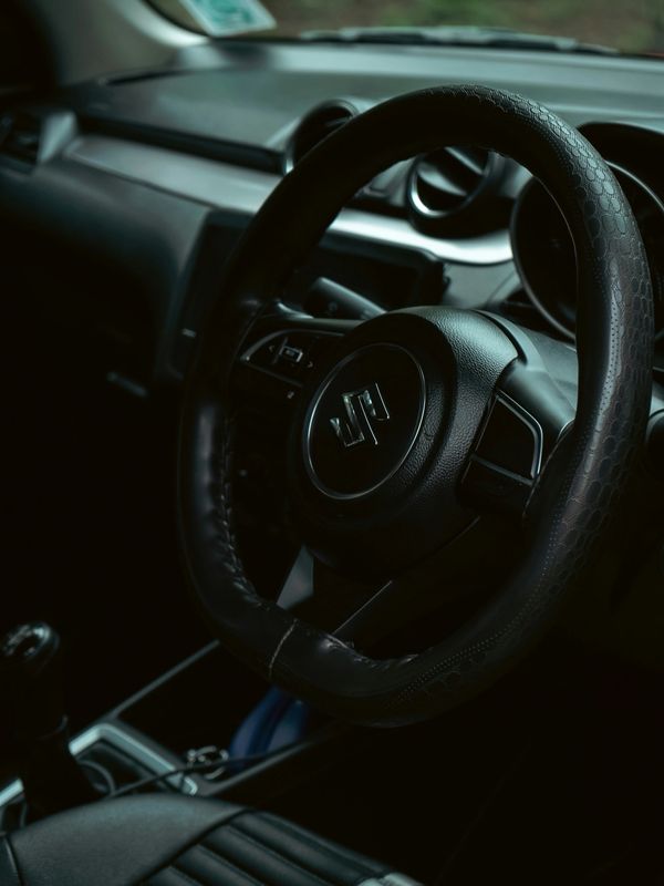 Steering wheel and interior of a Suzuki car