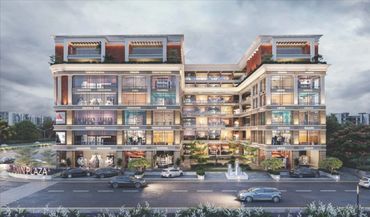 Modern shopping plaza with multiple brand stores and cars parked outside.