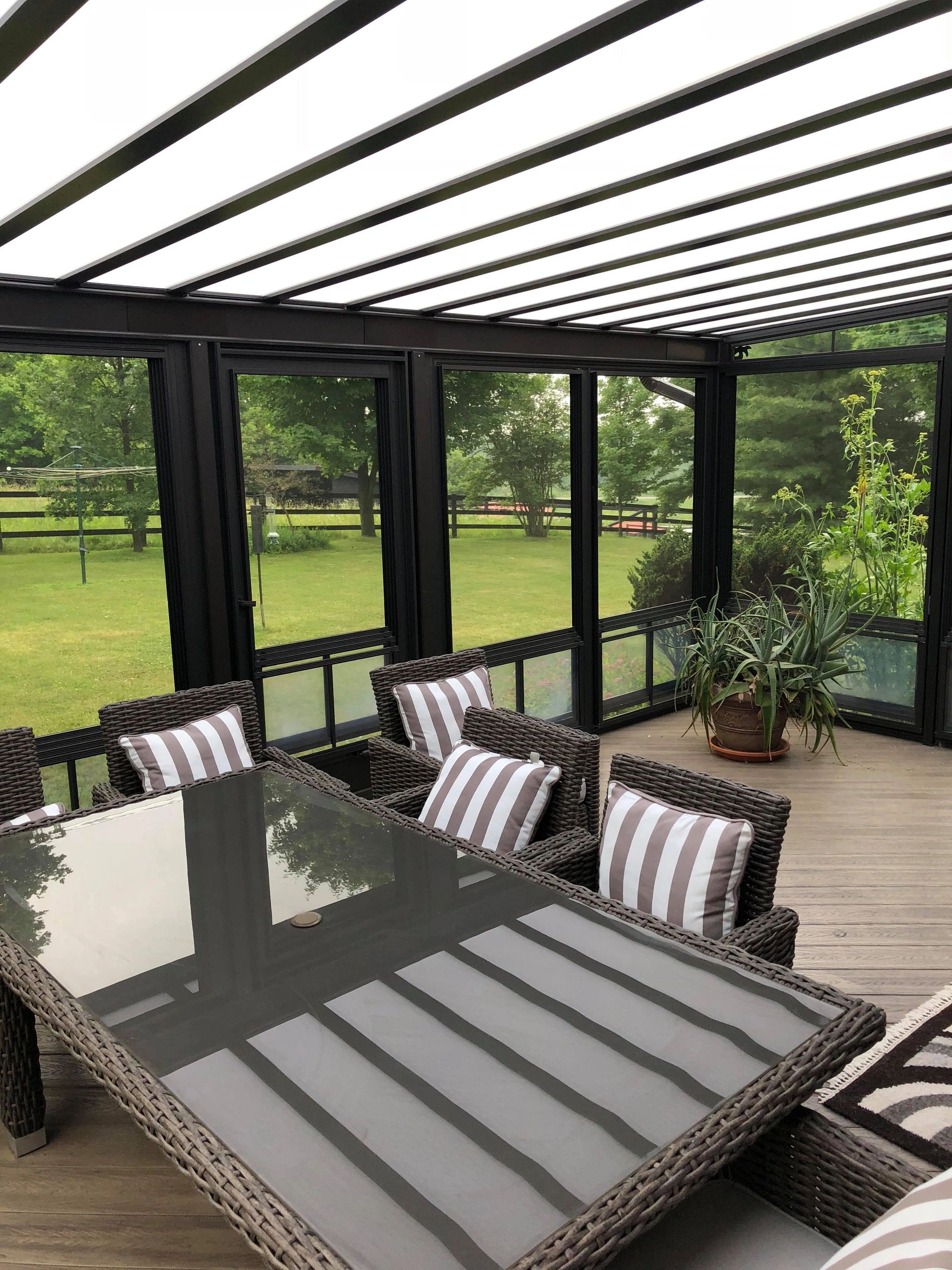 Natural light heat stop acrylic aluminum patio cover. Easily installed custom porch enclosure.