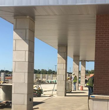 Midland Limestone Custom Cut Signature Panels with a custom Smooth Sill for the brick-to-stone trans