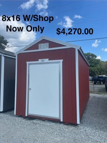 Red 8x16 storage shed with white door for sale.