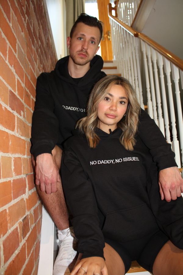 female and male model wearing a hoodie