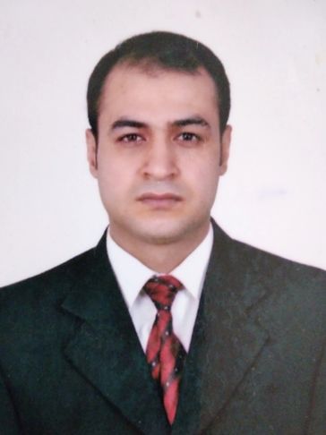Man in a suit and red tie.