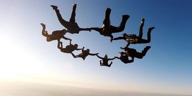 group of parachutists, team work, collaboration, exertise