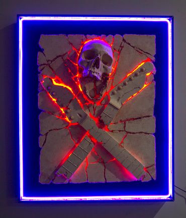Heavy Rock fossil skull and guitar cross bones. LED lighting and custom framing.