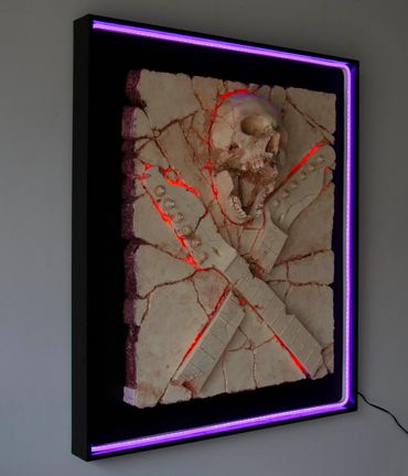 Heavy Rock fossil skull and guitar cross bones. LED lighting and custom framing.