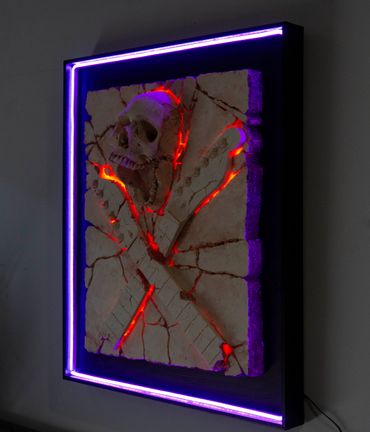 Heavy Rock fossil skull and guitar cross bones. LED lighting and custom framing.