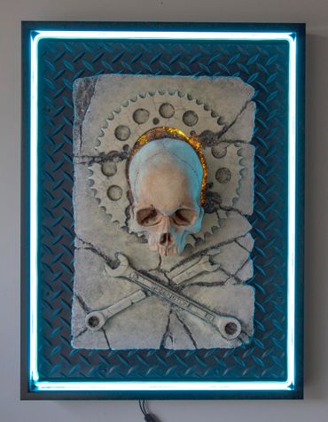 JOLLY WRENCHER fossil skull and wrenches cross bones. LED lighting and custom frame.