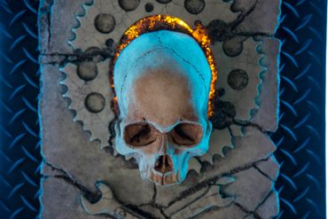 JOLLY WRENCHER fossil skull and wrenches cross bones. LED lighting and custom frame.