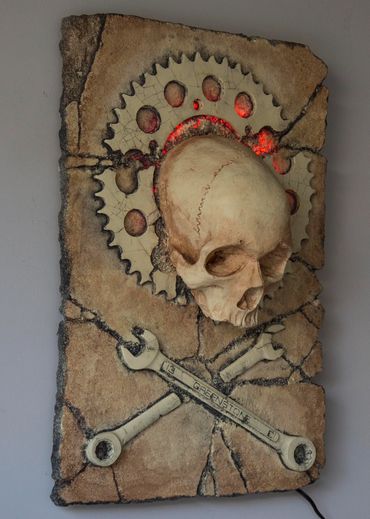 JOLLY WRENCHER fossil skull and wrenches cross bones. LED lighting and irregular edge.