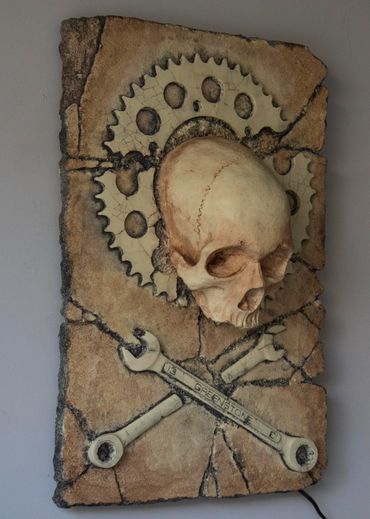 JOLLY WRENCHER fossil skull and wrenches cross bones. LED lighting and irregular edge.