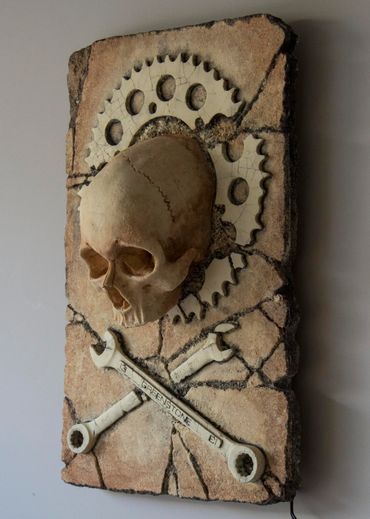 JOLLY WRENCHER fossil skull and wrenches cross bones. LED lighting and irregular edge.